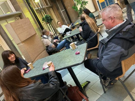 A group of people drinking coffee