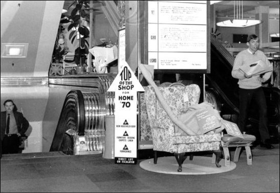 Photograph of customers using the stair elevators, c1970.  (GUAS Ref: HF 51/6/1/5/5 photo 2. Copyright reserved.)