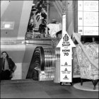 Photograph of customers using the stair elevators, c1970.  (GUAS Ref: HF 51/6/1/5/5 photo 2. Copyright reserved.)