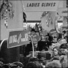 Photograph of customers browsing the sale items during the winter sale, c1960.  (GUAS Ref: HF 51/6/1/5/3 photo 2. Copyright reserved.)