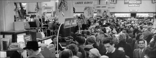 Photograph of customers browsing the sale items during the winter sale, c1960.  (GUAS Ref: HF 51/6/1/5/3 photo 2. Copyright reserved.)