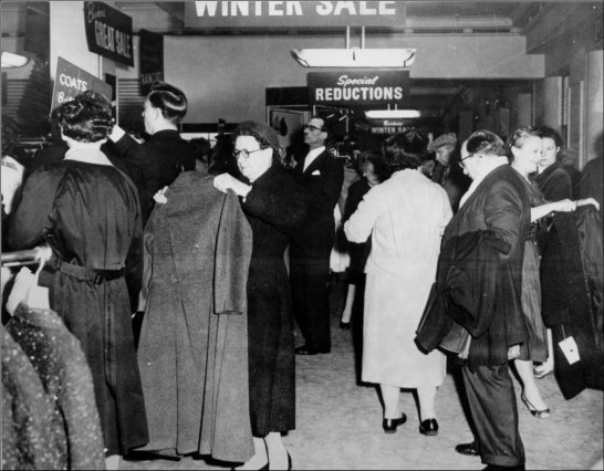 Photograph of customers browsing the sale items during the winter sale, c1957.  (GUAS Ref: HF 51/6/1/5/1. Copyright reserved.)