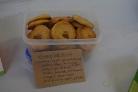 photo of a tub of light almond biscuits baked by a wintering well participant to share with others