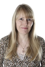 Female with shoulder length blonde hair smiling 